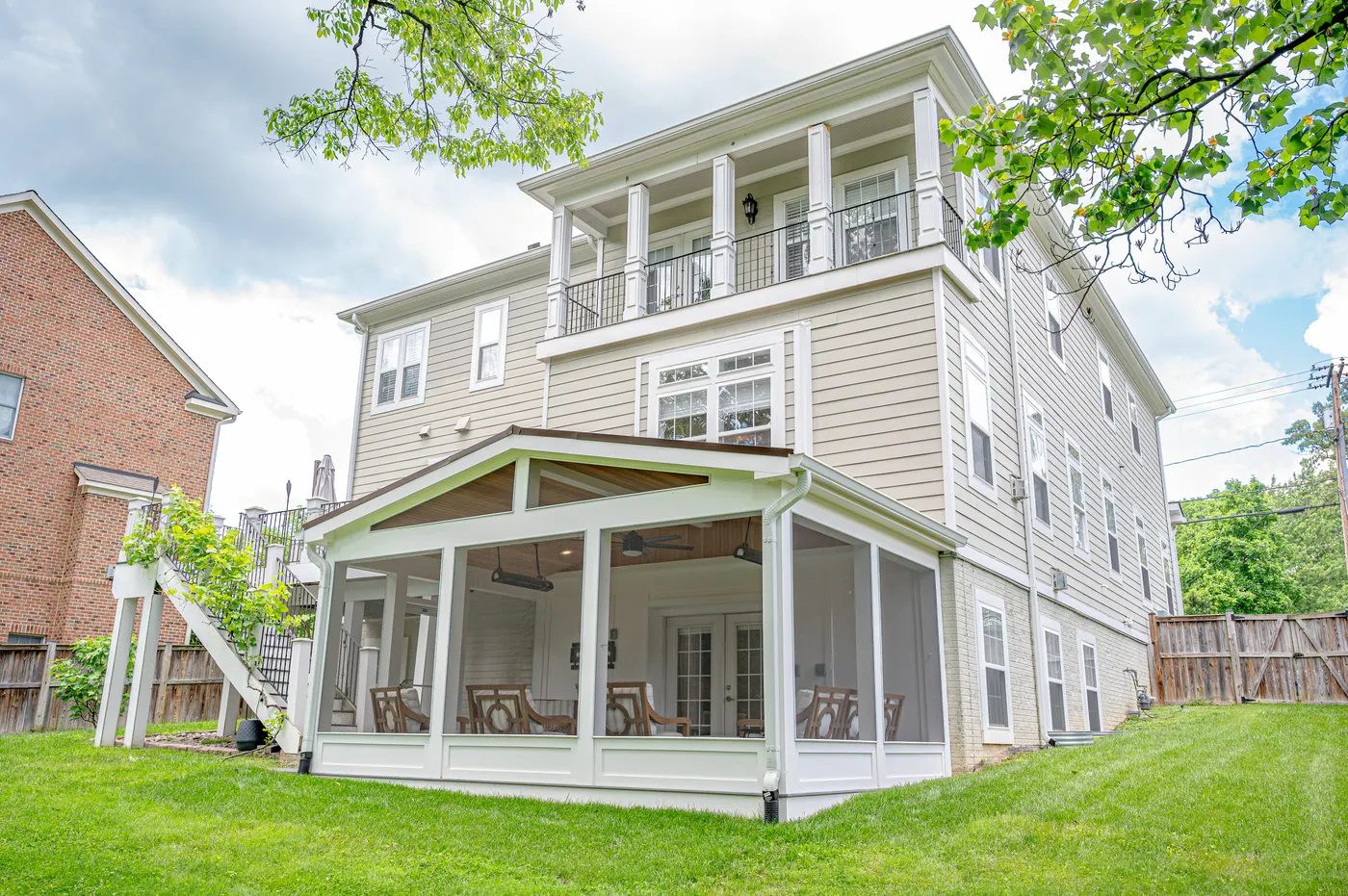 The finished porch below a three-story home